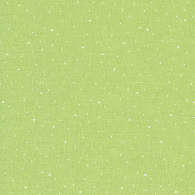 A light spring green fabric with scattered small white dots.