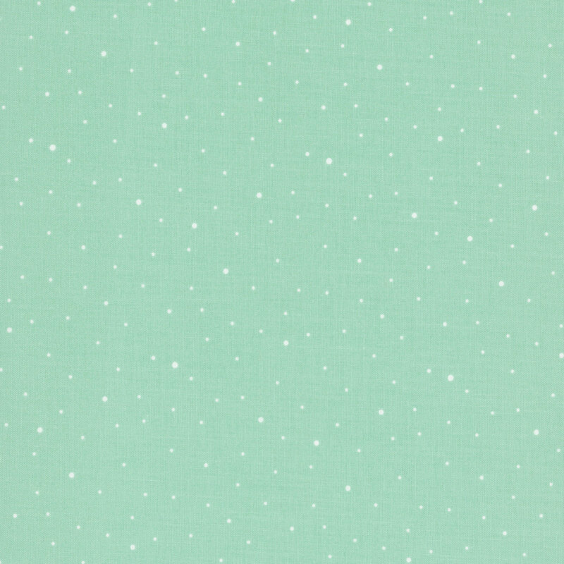 A mint green fabric with scattered small white dots.