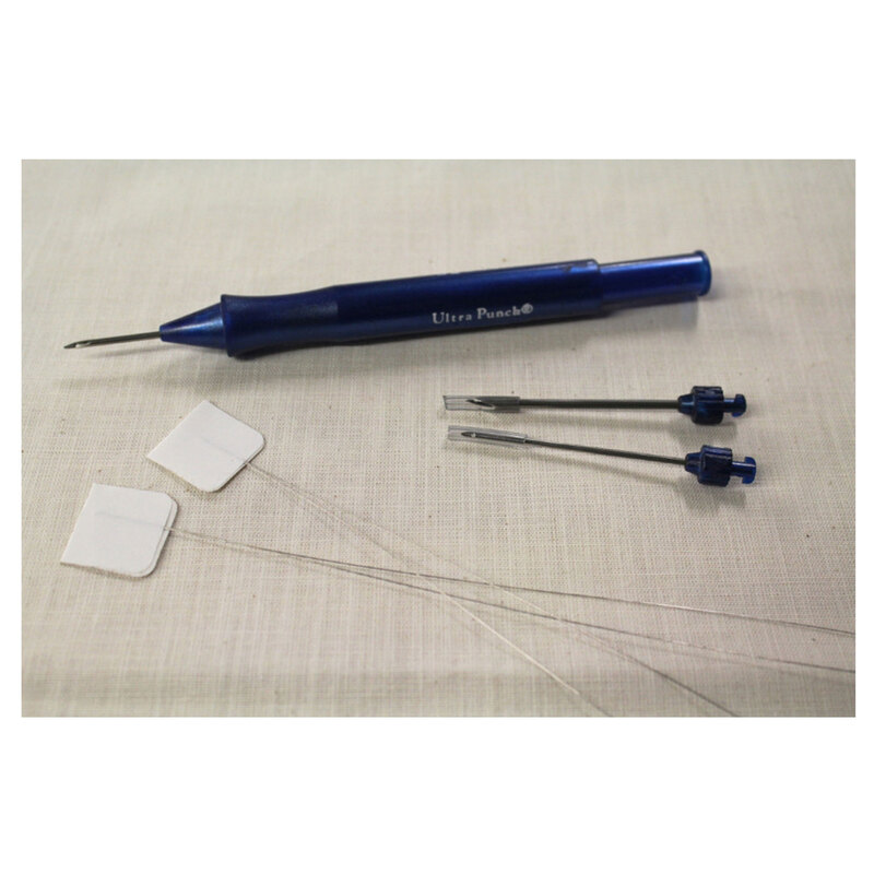 The Ultra Punch Needle Set, isolated on a linen fabric background.