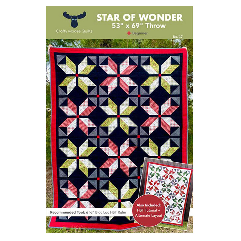 A dynamic quilt featuring a star patchwork pattern in various fabrics, titled Star of Wonder.