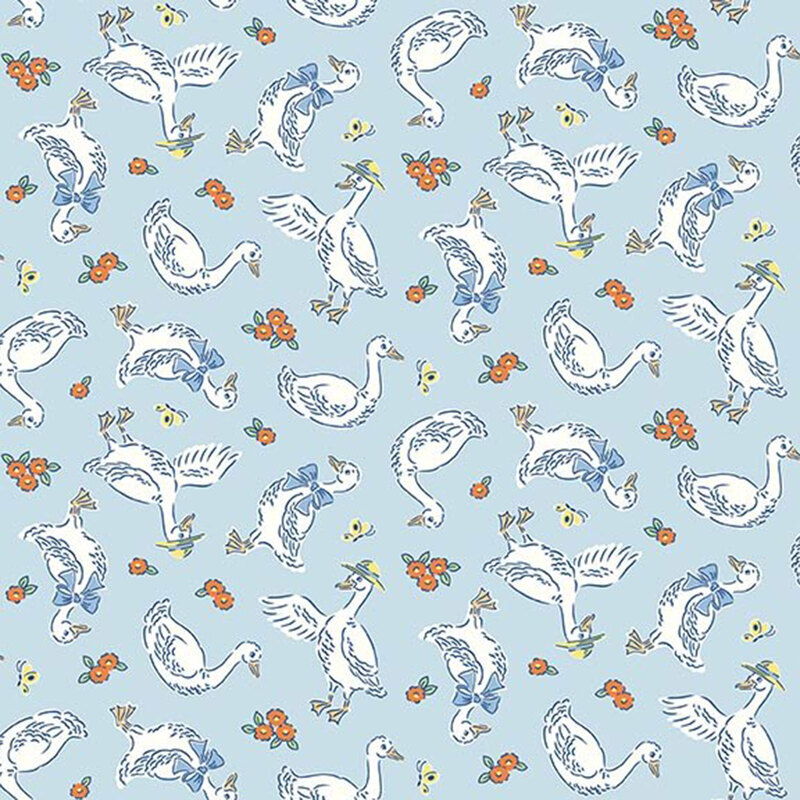Pastel blue fabric with a pattern of white geese wearing blue bows and yellow hats, along with orange and yellow flowers