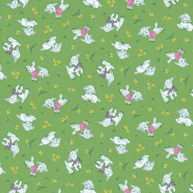 Grass green fabric with a cute pattern of snow white lambs wearing pink sweaters and bows, along with small yellow flowers