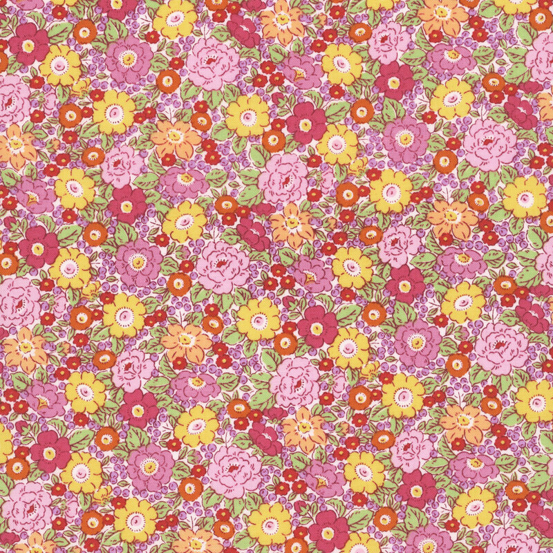 Dense multicolor floral fabric in pink, fuchsia, orange, and yellow on a light blush pink background