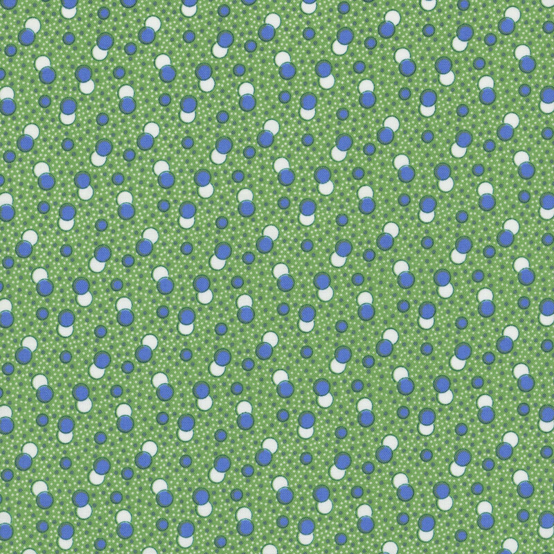 Grass green fabric with a primitive pattern of denim blue and white circles
