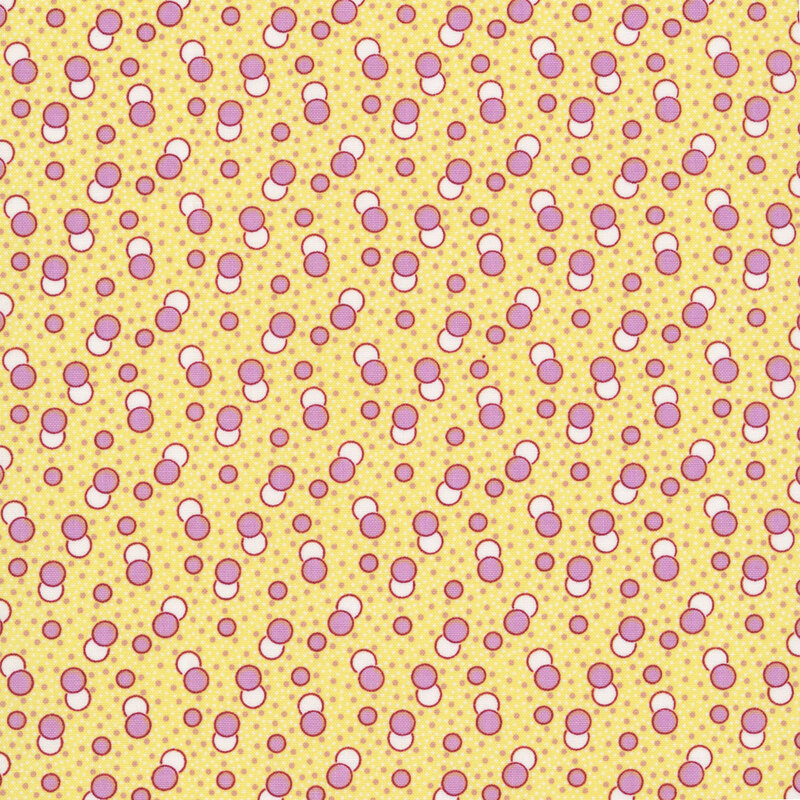Daffodil yellow fabric with a primitive pattern of lavender and white circles