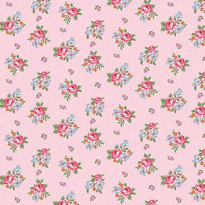 Vintage inspired fabric with bunches of pink roses and blue flowers, small pink floral buds, and pin dots on a ballet pink background