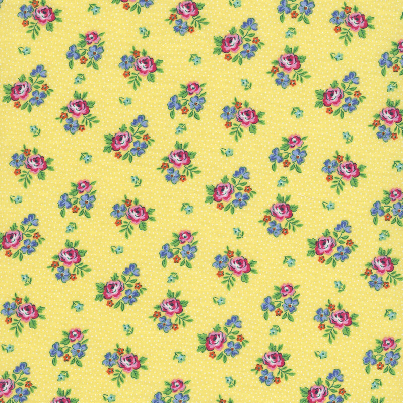Vintage inspired fabric with bunches of pink roses and blue flowers, small pink floral buds, and pin dots on a daffodil yellow background