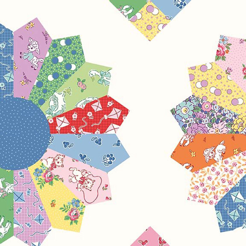 Cloud white fabric with a cheater quilt pattern featuring patterns from the collection