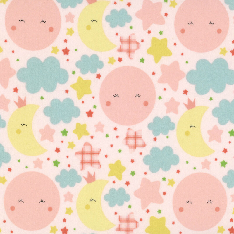Light pink fabric with cute, blushing pink suns and yellow moons amid pastel colored stars and clouds.
