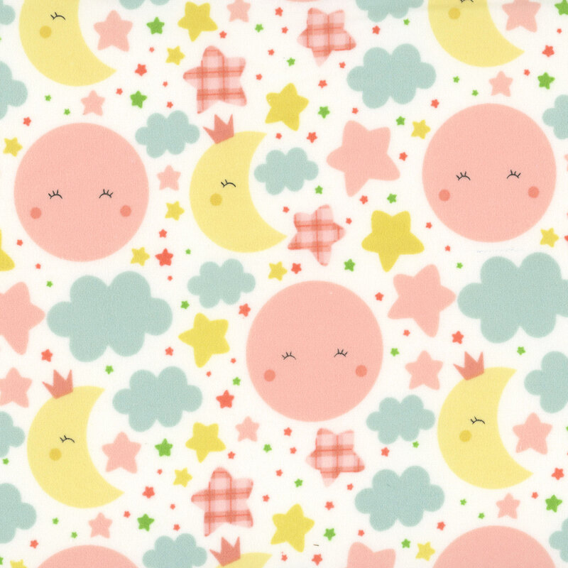 White fabric with cute, blushing pink suns and yellow moons amidst pastel colored stars and clouds.