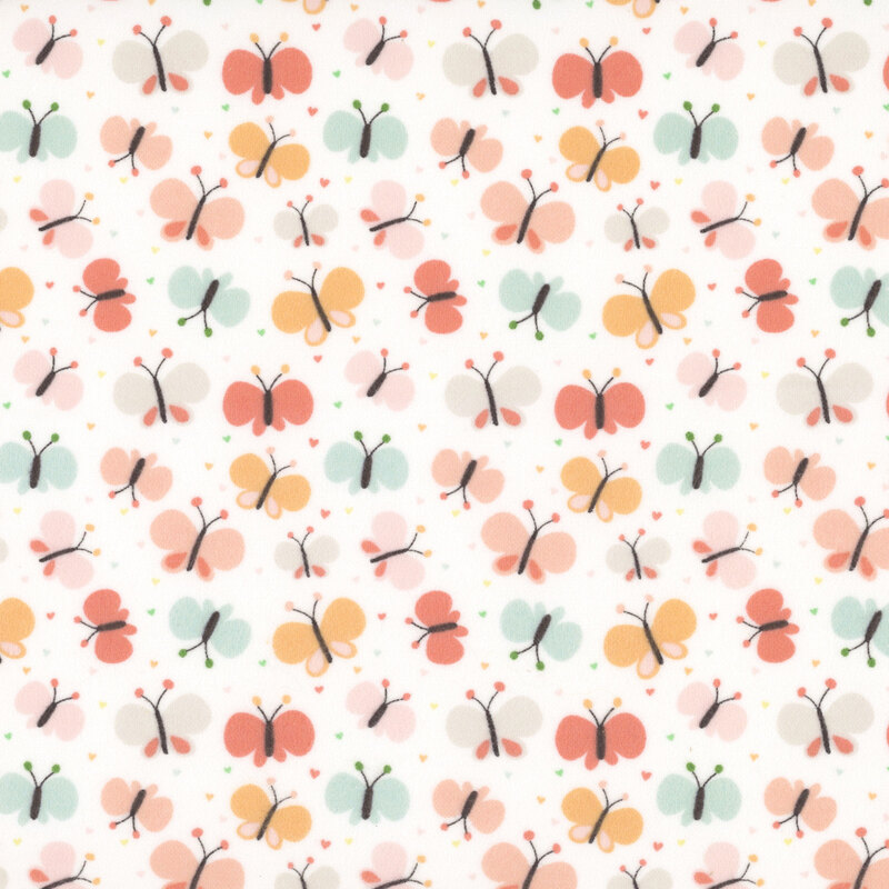 White fabric with a pattern of cartoonish butterflies in coral, orange, turquoise, and pink