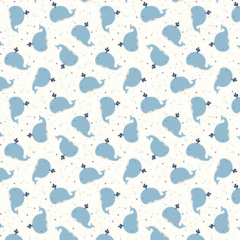 Cream fabric with tiny variegated pindots and a ditsy pattern of cute blue whales