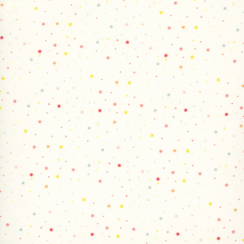 ivory fabric with a delicate pattern of small warm-toned multicolor stars and dots