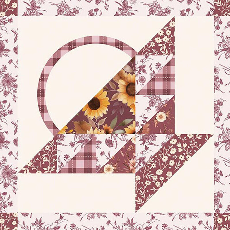 A cheater fabric with a patchwork basket design with patterns from the collection in muted wine red on a cream background. 