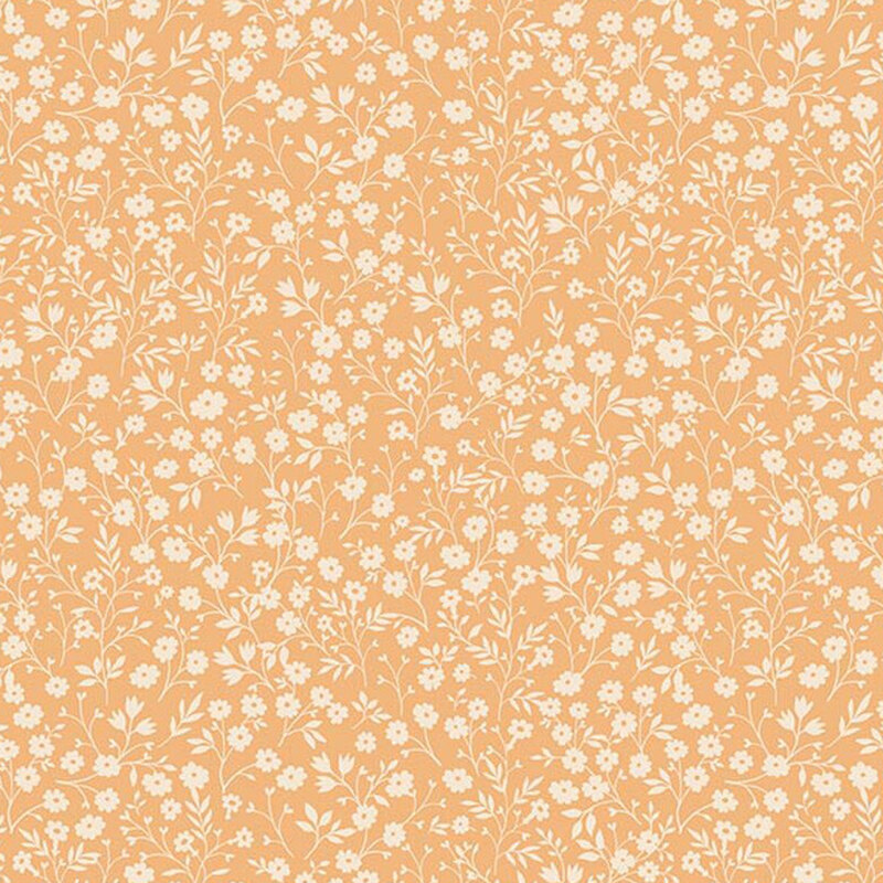 Apricot fabric with a dense pattern of cream flowers and stems