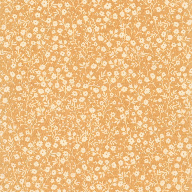 Yellow fabric with a dense pattern of cream flowers and stems