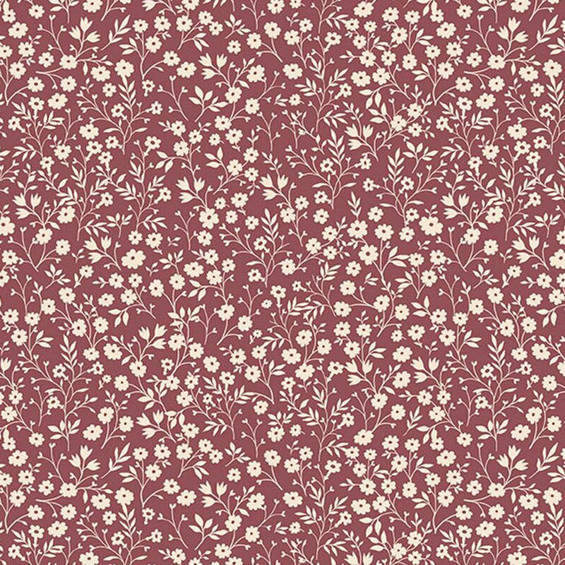 Deep cherry fabric with a dense pattern of cream flowers and stems