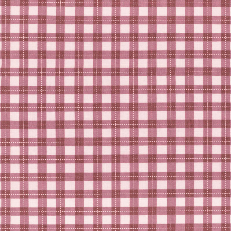 A mulberry gingham print on a dusty rose pink background