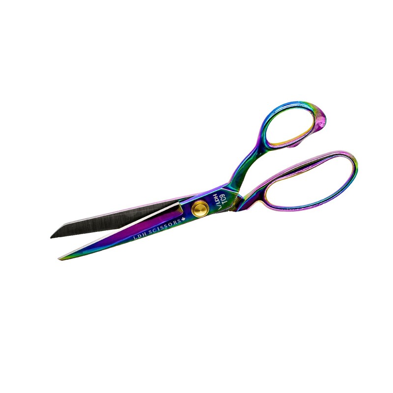 A pair of rainbow-colored scissors with a shiny finish and rounded handles.