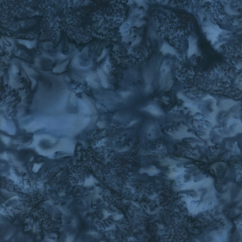 Marbled batik fabric in shades of dark blue.