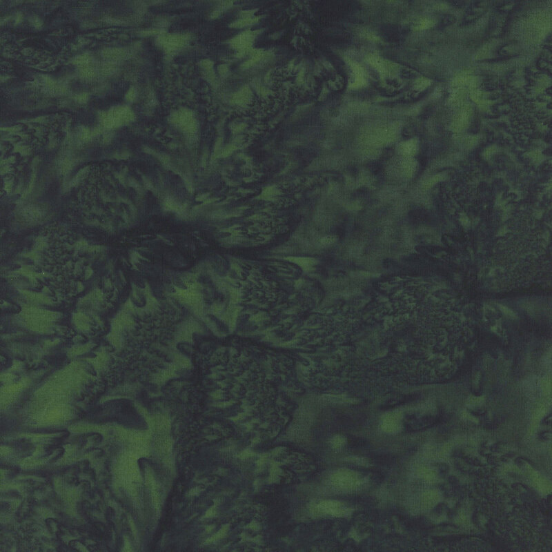 Marbled batik fabric in shades of forest green.