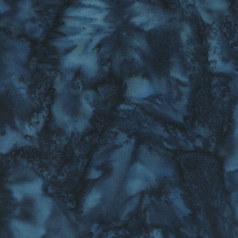 Marbled batik fabric in shades of very dark blue.
