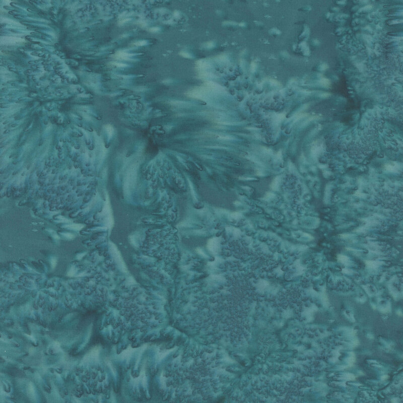 Marbled batik fabric in shades of dark teal.
