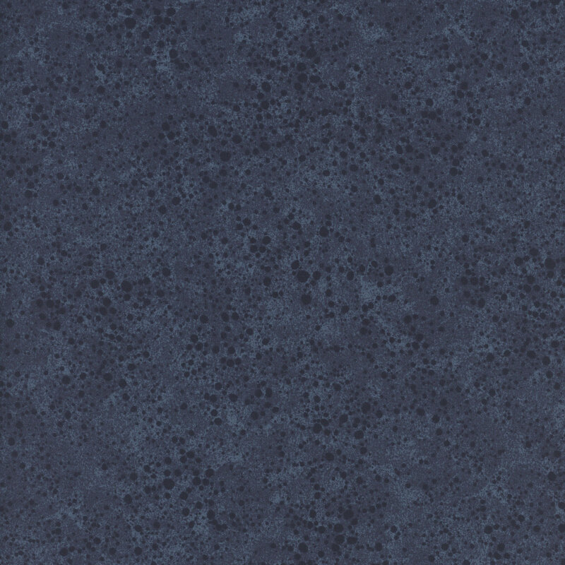A dark denim blue swatch of fabric with a tonal grunge and paint splatter effect.