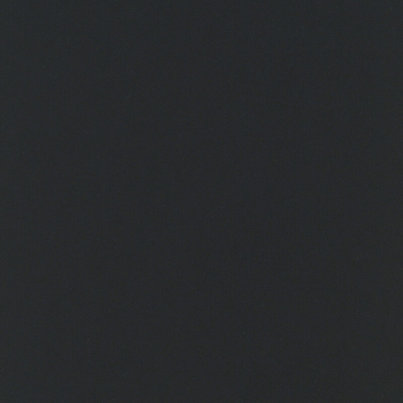 Swatch of solid, pitch black flannel fabric.