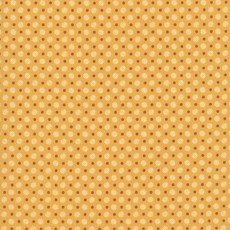ocher fabric with a pattern of gold dots and striped, cream circles