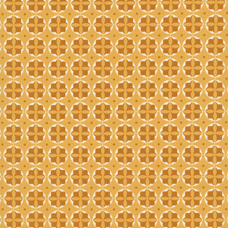 Honey yellow fabric with cream circles containing dark yellow floral rosettes along with dark gold dots