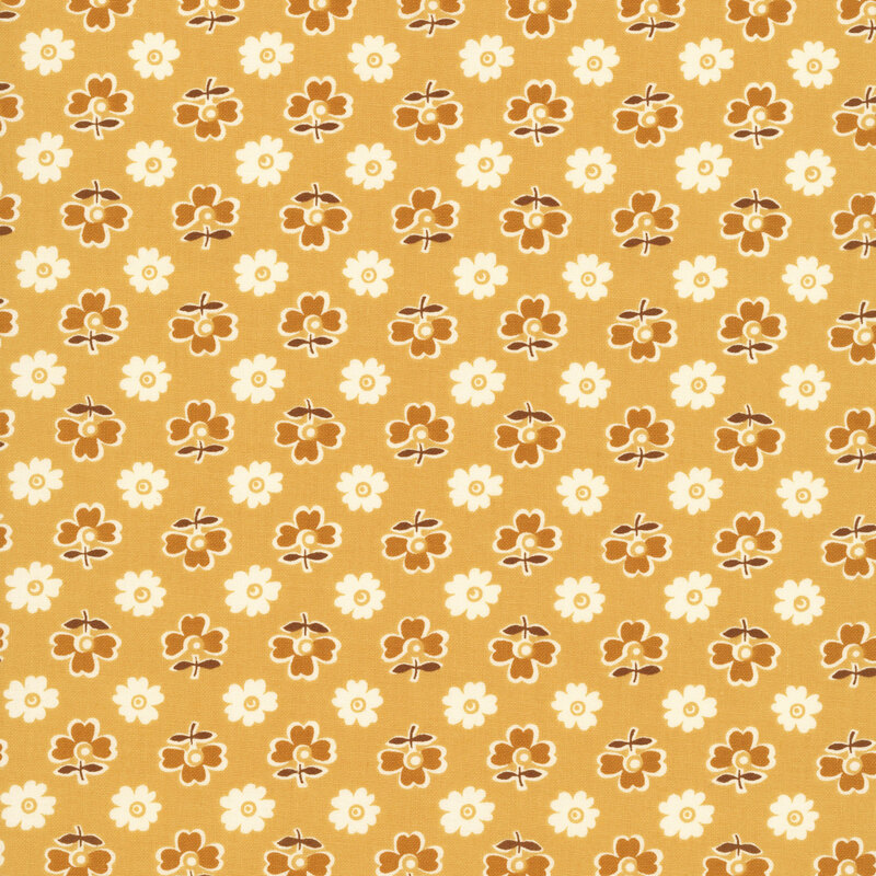 Honey yellow fabric with an alternating pattern of gold and white flowers