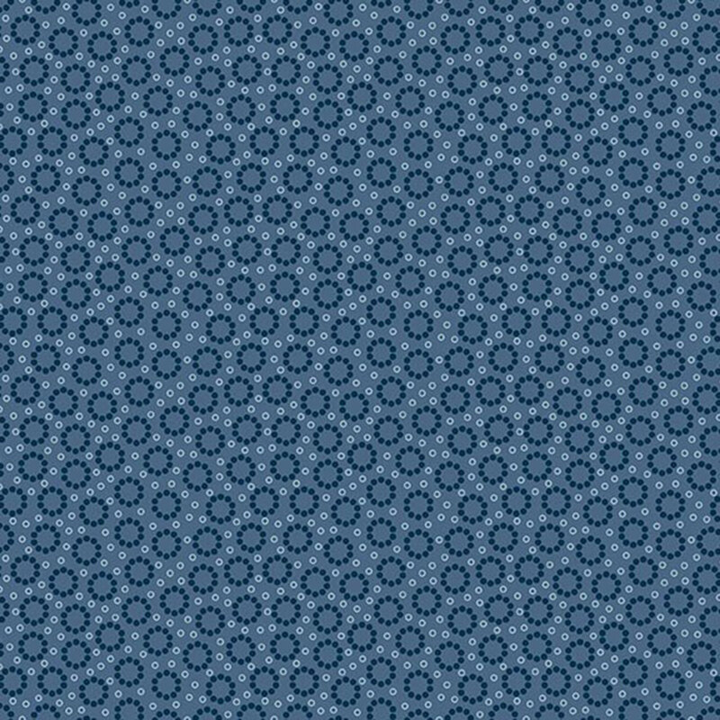Primitive navy blue and white circles on a denim blue background