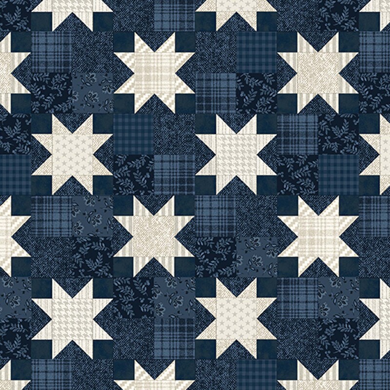 Cream-toned patchwork stars on a patchwork-style navy blue fabric