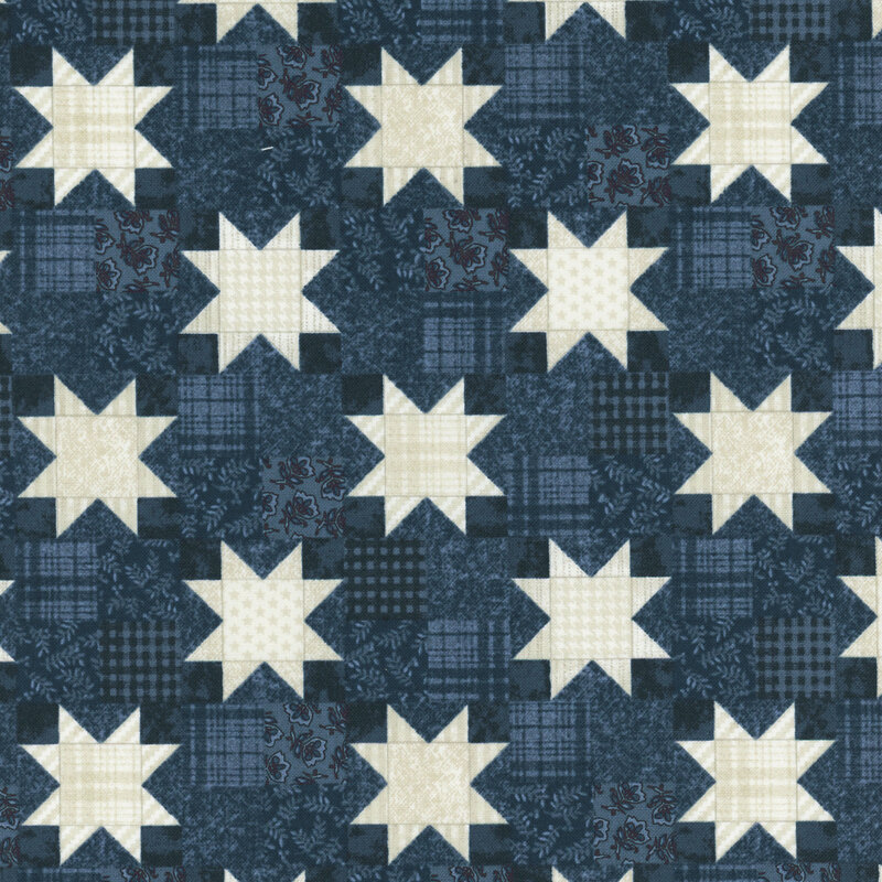 Cream-toned patchwork stars on a patchwork-style navy blue fabric