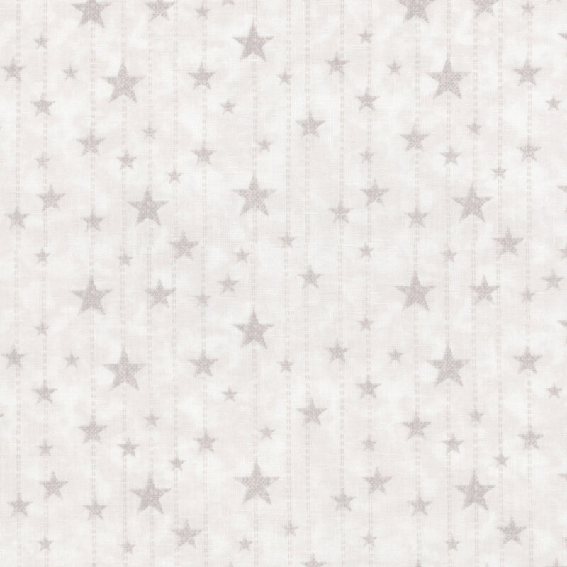 Mottled oyster white fabric with beige dotted lines and small, medium, and large stars