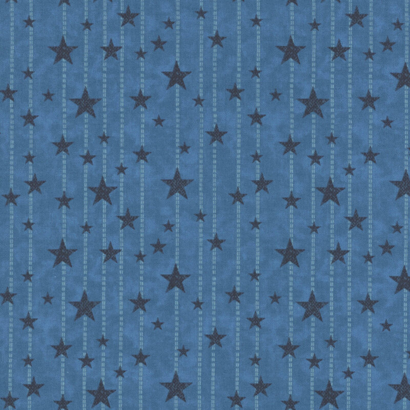 Mottled denim blue fabric with light blue dotted lines and small, medium, and large indigo stars