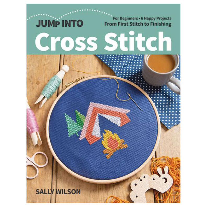 The front of the Jump Into Cross Stitch Book showing a completed campfire project and coordinating supplies.