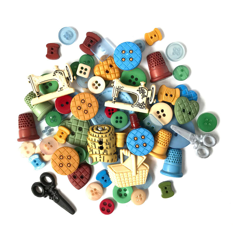 A pile of Sewing-themed buttons and embellishments, including sewing machines, scissors, measuring tape, baskets, and thimble shapes.