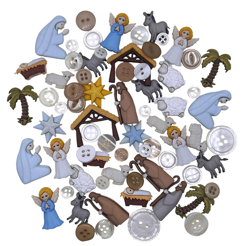 A pile of Nativity-themed buttons and embellishments, including baby Jesus, Mary, Joseph, guiding stars, and various barn animal shapes. 