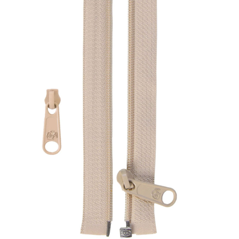Tan zipper with a pull tab, laid flat against a light background. Smaller pull tab is shown to the side.