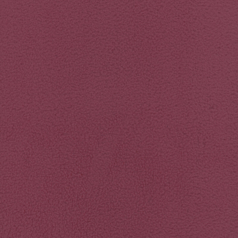 Solid fleece fabric swatch in plum.