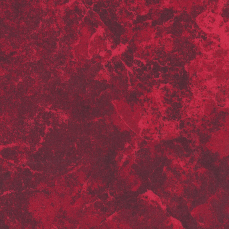 A swatch of red flannel fabric with a mottled pattern.