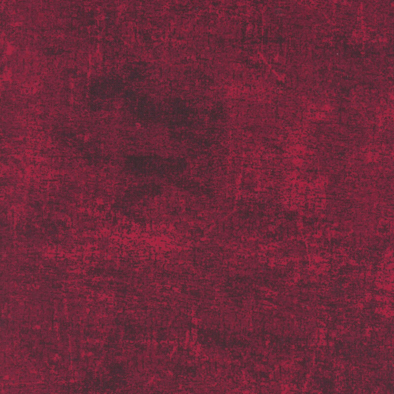 A swatch of red flannel fabric with a grunge texture.