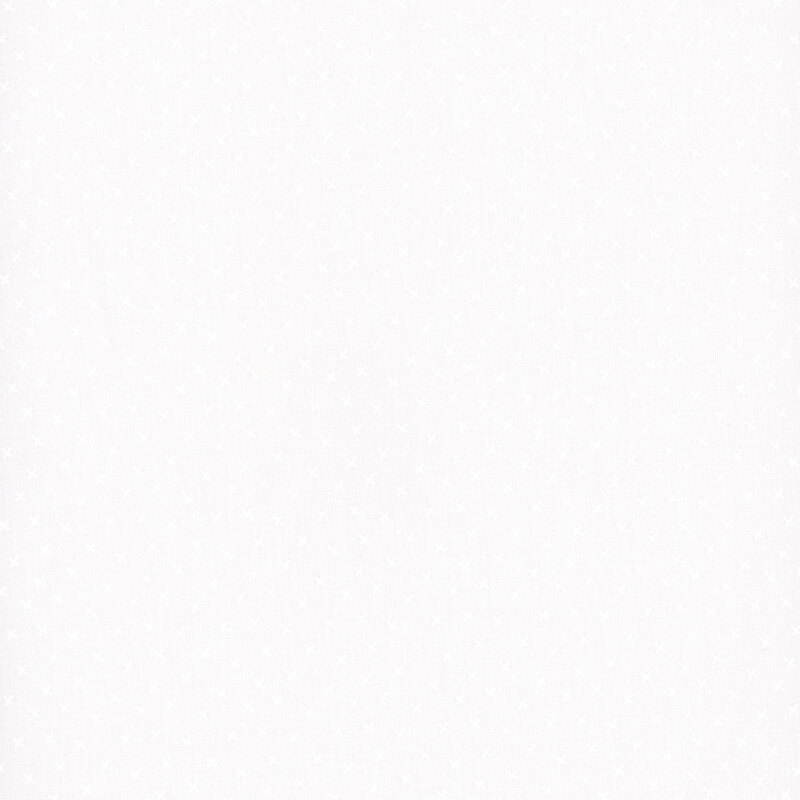 White on white fabric featuring scattered small x's.
