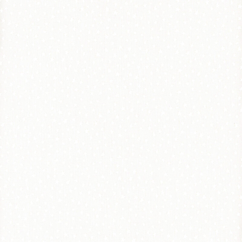 White on white muslin fabric featuring tiny, irregularly shaped stars.