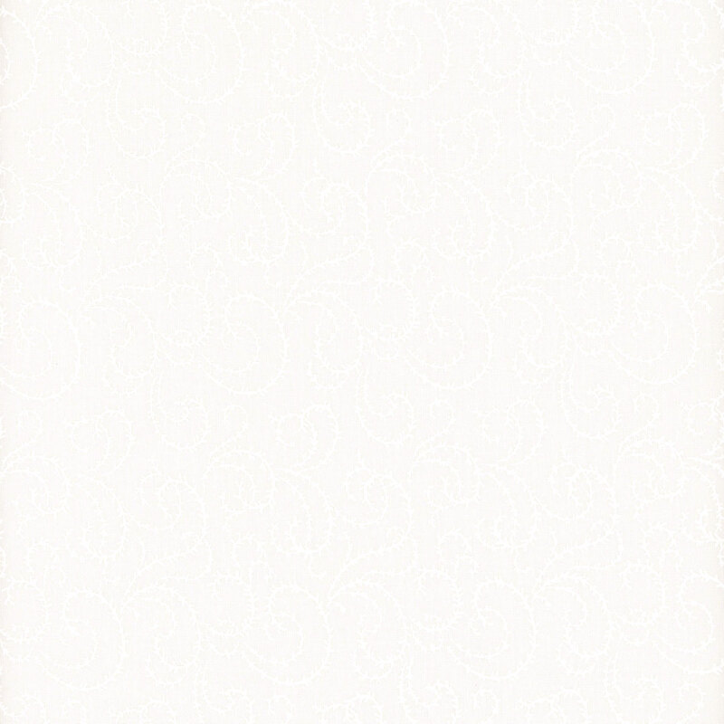 White on white muslin fabric featuring vines in a paisley design.