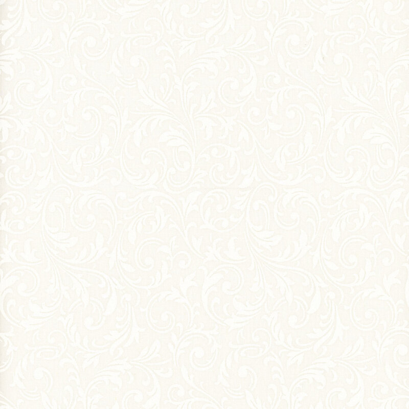 White on white muslin fabric featuring swirling, ornamental leaves.