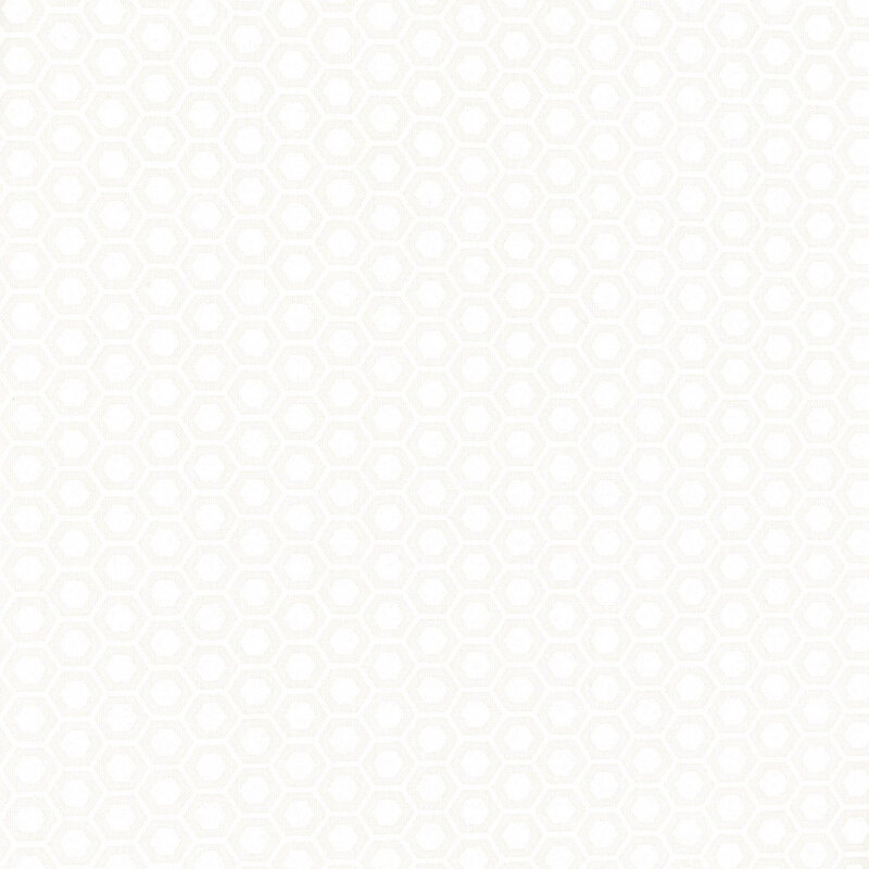 White on white muslin fabric packed with hexagonal shapes.