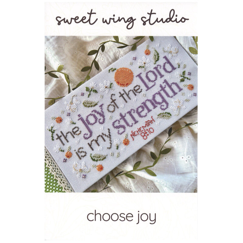 The front of the Choose Joy cross stitch pattern, showing the completed project with coordinating décor.